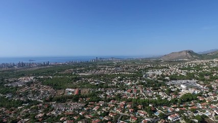Panoramic drone view of Spanish coastal communities of La Nuccia and Benidorm