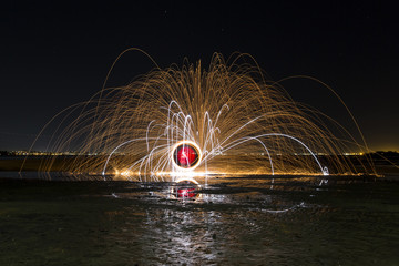 Steel Wool and Magnesium spinning in ocean water on beach