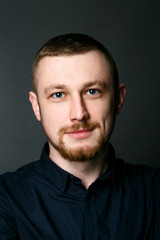 Obraz premium Portrait of dark blonde man in black shirt