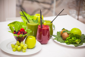 Healthy green and red smoothies and ingredients - superfoods, detox, diet, health, vegetarian food concept.