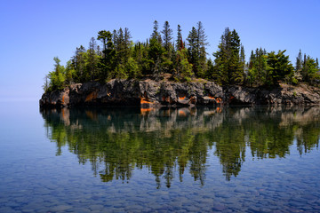 Fototapeta na wymiar Reflection in Lake Superior water Ellingson Island MN 
