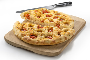 Apulian flat bread with tomatoes and knife