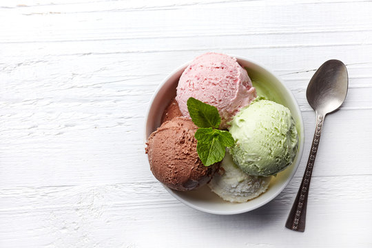 Naklejki Bowl of various colorful ice cream balls