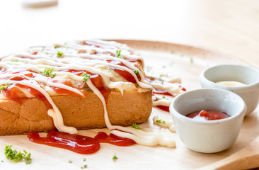 Pizza toasted bread with tomato sauce and ham cheese selective focus