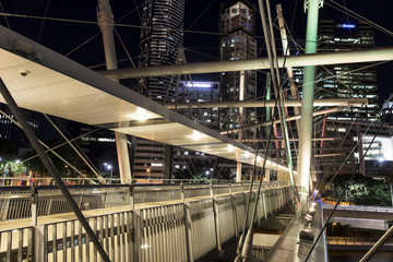 Kurilpa Bridge illuminated pedestrian architecture closeup looking towards Brisbane CBD  