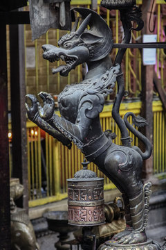 Dragon statue Hiranya Varna Mahavihar - Golden Temple, prayers wheels and statue, Patan, Nepal