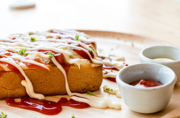 Pizza toasted bread with tomato sauce and ham cheese selective focus.