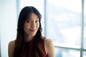 Smiling woman standing in office