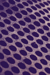 Dirty metal sheet with perforations.