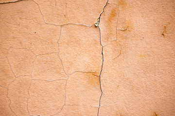 Old pink wall with cracks