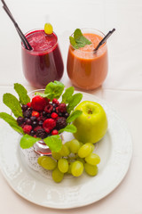 Healthy red smoothies and ingredients - superfoods, detox, diet, health, vegetarian food concept.
