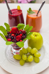 Healthy red smoothies and ingredients - superfoods, detox, diet, health, vegetarian food concept.