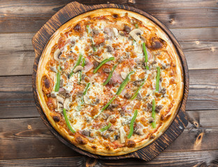 Pepperoni pizza on a board