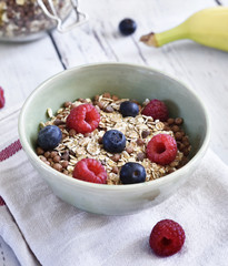 Delicious cereal breakfast with bowl and fresh fruits