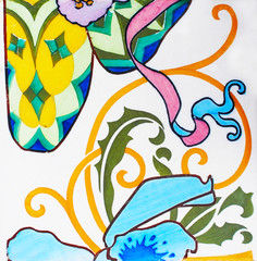 Detail of the traditional tiles from facade of old house. Spain. Valencia. Floral ornament. Majolica,