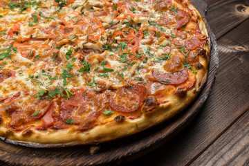 Pepperoni pizza on a board