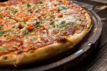 Pepperoni pizza on a board