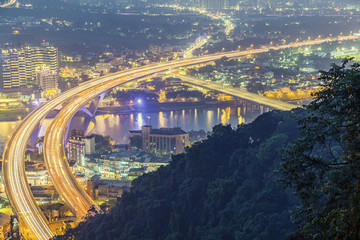 New Taipei City - April 29, 2016 : Lion's Head Mountain Shooting, aerial view of taipei at night with highway, night cityscape - Asia