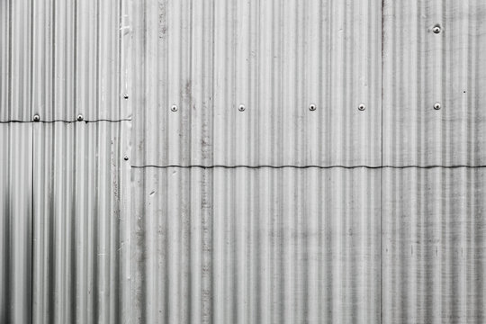 Gray corrugated metal fence texture
