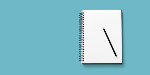 Open notebook on white background with a pencil