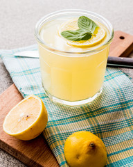 Lemonade drink of soda water with mint leaves and lemon.