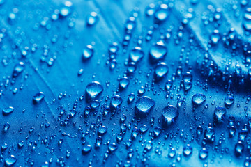 Rain Water droplets on blue  background