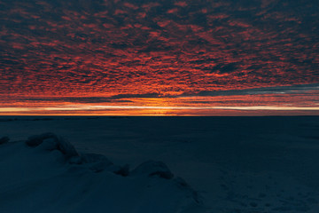 winter landscape - sunset in the snow field © cmirnovalexander