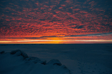 winter landscape - sunset in the snow field © cmirnovalexander