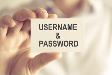 Businessman holding USERNAME AND PASSWORD message card