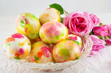 Easter eggs and pink roses bouquet