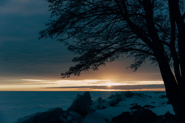 winter landscape - sunset in the snow field © cmirnovalexander