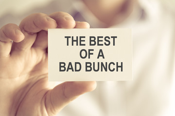 Businessman holding THE BEST OF A BAD BUNCH message card