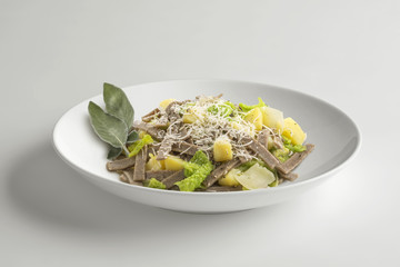 Bowl with portion of pizzoccheri