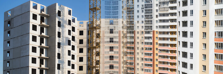 Panorama of the construction of modern concrete buildings