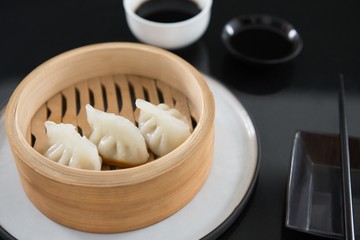 Steamed dumplings in bamboo steamer