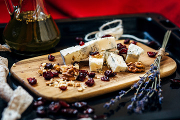 Cheese plate: cheese,  walnuts,  raisins