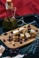 Cheese plate: cheese,  walnuts,  raisins