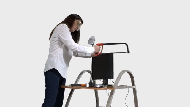 Angry office worker destroying desktop computer with hacksaw and sledgehammer. 4k footage PNG with alpha channel