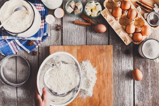 Making dough top view on rustic wood background