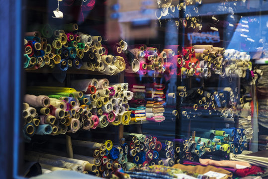 Rolls Of Cloth For Sale In A Fabric Shop In Rome, Italy