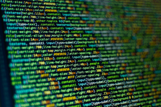 Software development. Software source code. Programming code. Writing programming code on laptop.