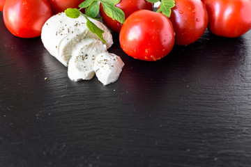 Italian food, caprese salad ingredients, tomatoes, mozzarella and basil, healthy eating, vegetarian diet
