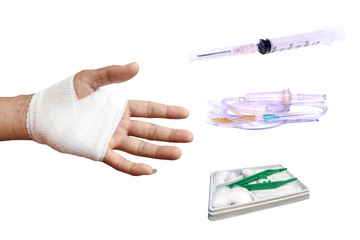 Injured painful hand with white gauze bandage and Wound Kit