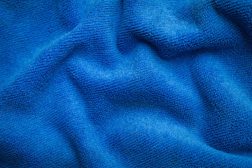 Fototapeta na wymiar abstract texture of draped blue velvet background