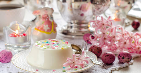 Beautiful Easter background with desserts and decor.