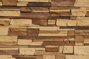 Wall finished with a decorative artificial stone