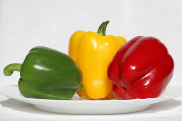 Three peppers: yellow, green, red