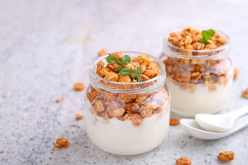 healthy breakfast: yogurt with muesli in jars