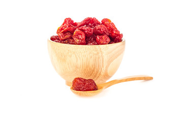 Closeup Sun-dried cocktail tomatoes in wooden spoon and cup on white background.