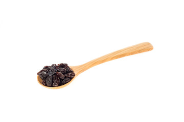 Dried raisins in wooden spoon on white background.